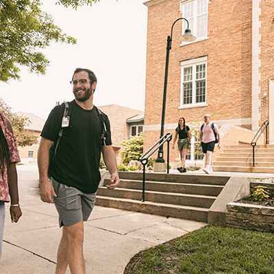 Students walking by Luther Hall