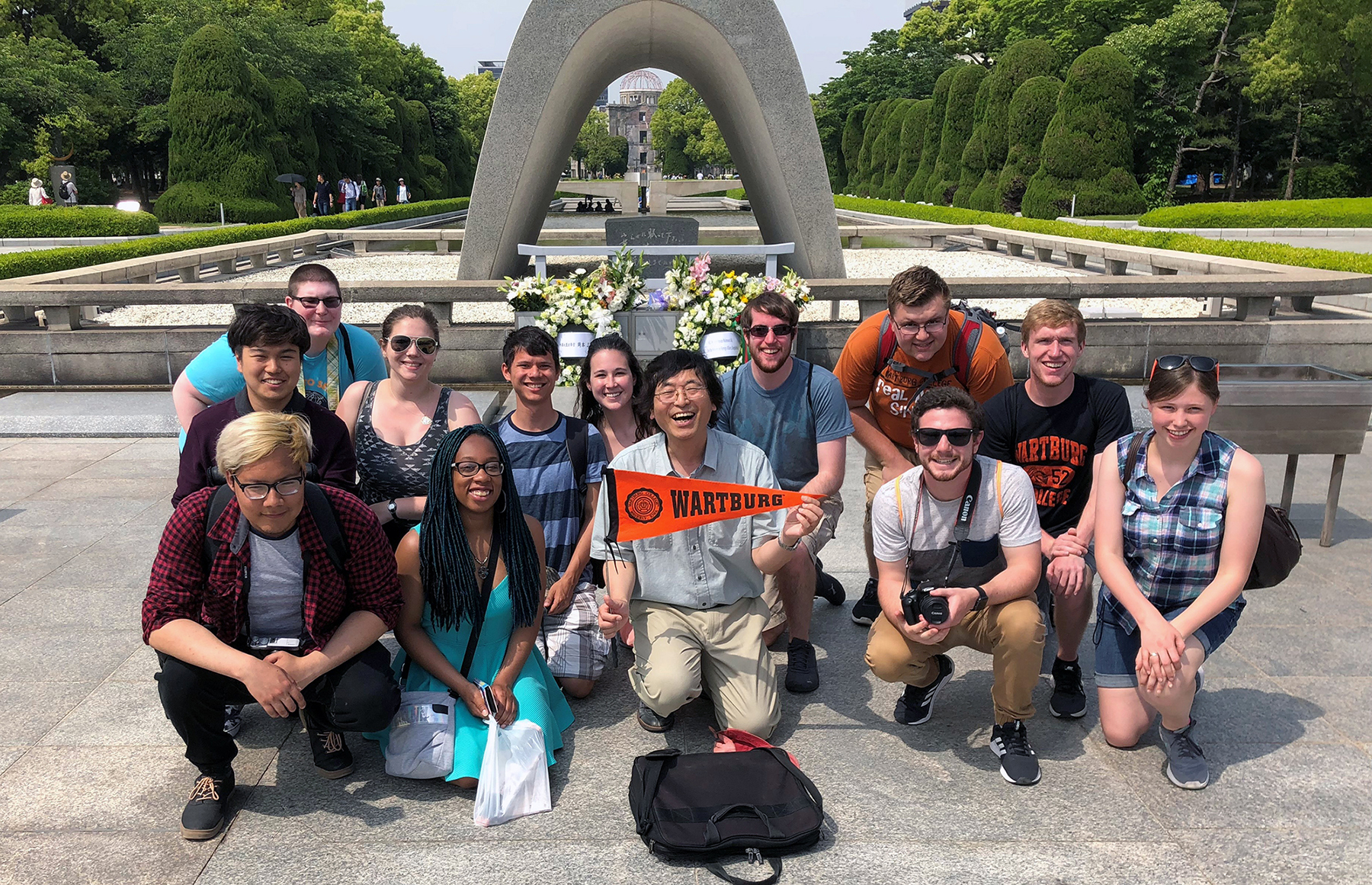 Dr. Kuni Terasawa and students visit a peace park in Japan.