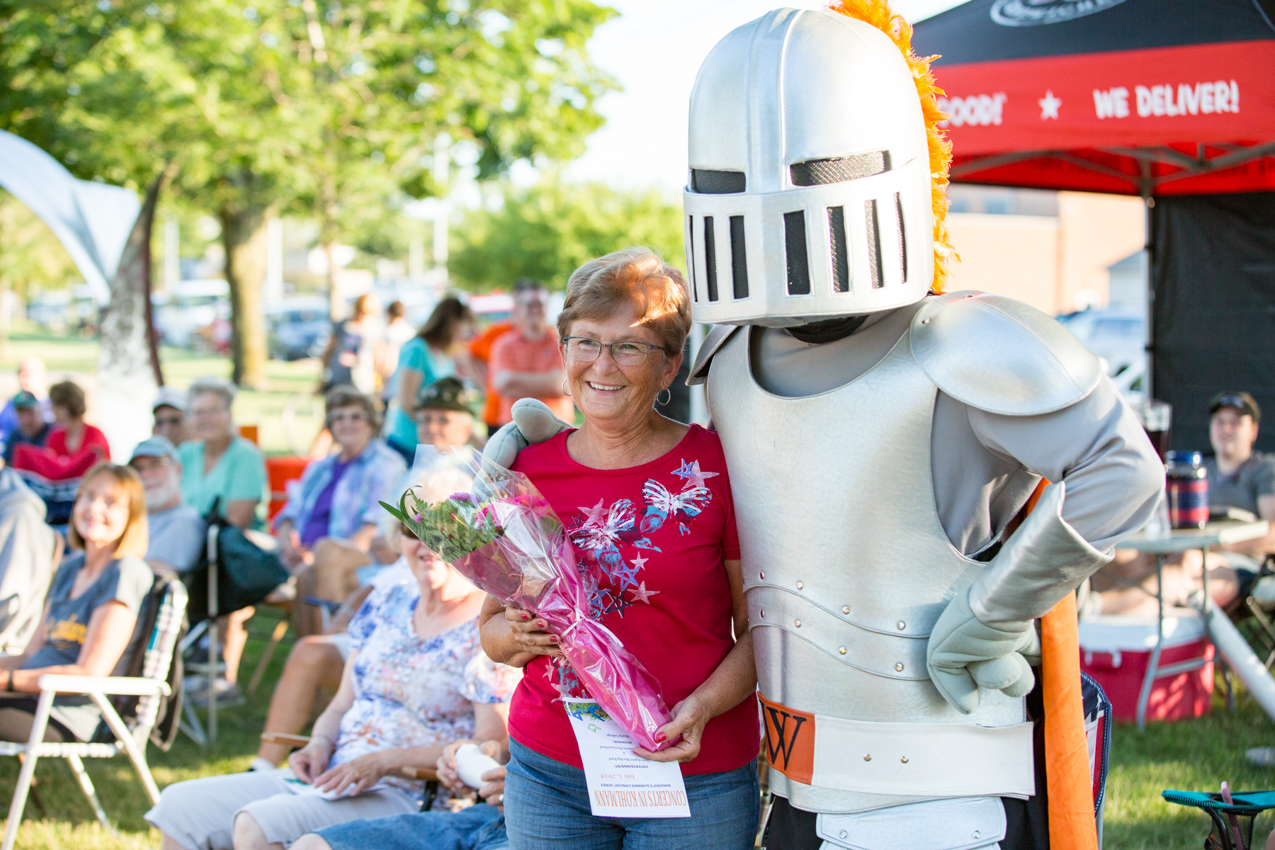 Sir Victor delivers flowers at Concerts in Kohlmann Park in July 2018