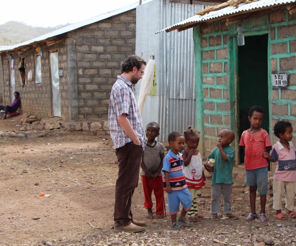 Jason Bell talks to some of the children he works with at a refugee camp in Shire, Ethiopia.