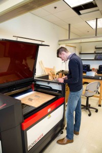 Jake Hamilton ’18 programs a new project for the laser printer in the Innovation Studio.