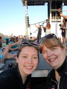 Lexi Bodzioch and Julie Drewes photograph the Maddie Poppe  American Idol concert in Allison. 