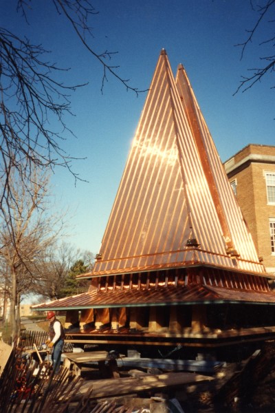 Chapel spires are prepared to be lifted to the top of the chapel