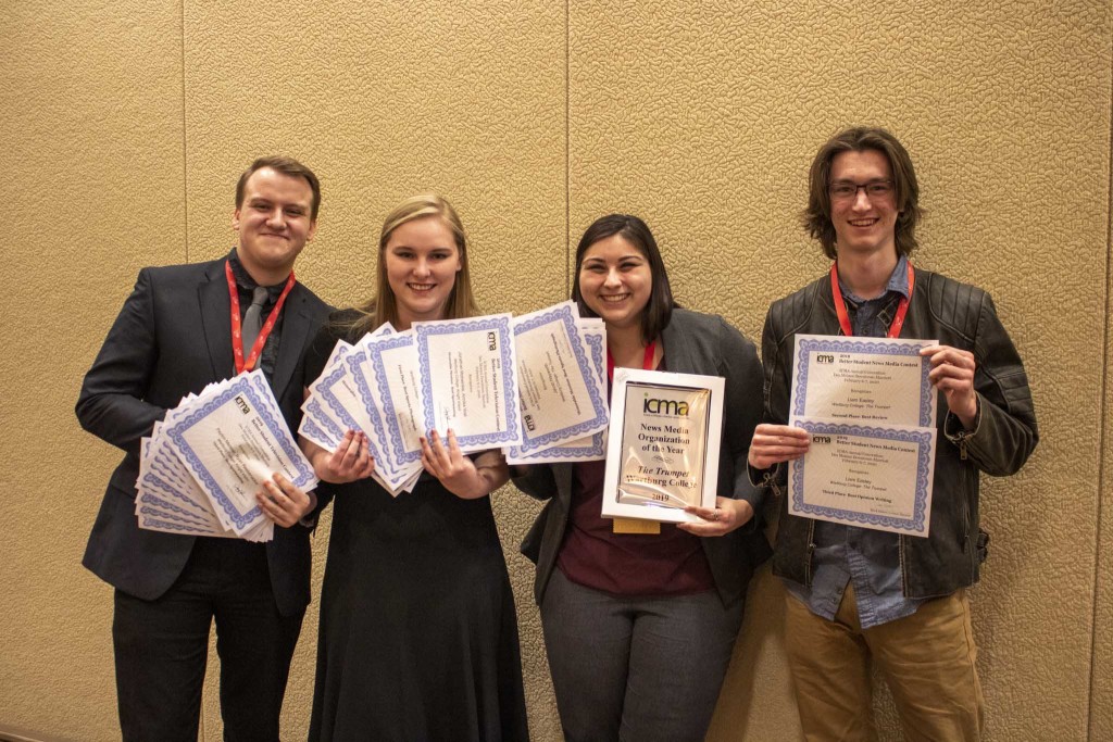 Ryan Reebenacker, Annika Wall, Silvia Oakland and Liam Easley show off the awards The Trumpet staff members earned at the ICMA conference.