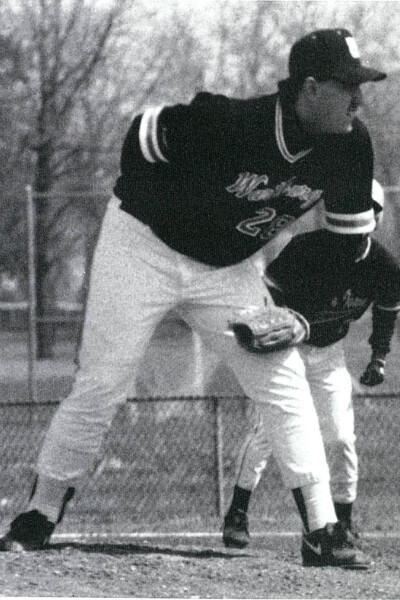 Jay Kelley stands on a pitching baseball mound in a photo scanned from the 1992 Fortress yearbook