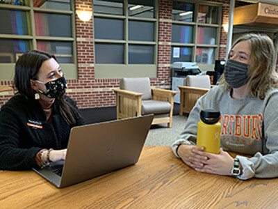 Sam Pfab and Ellie Nabholz meet in Cardinal Commons. Ellie is a student in the Wartburg Accelerated Ministry Program.