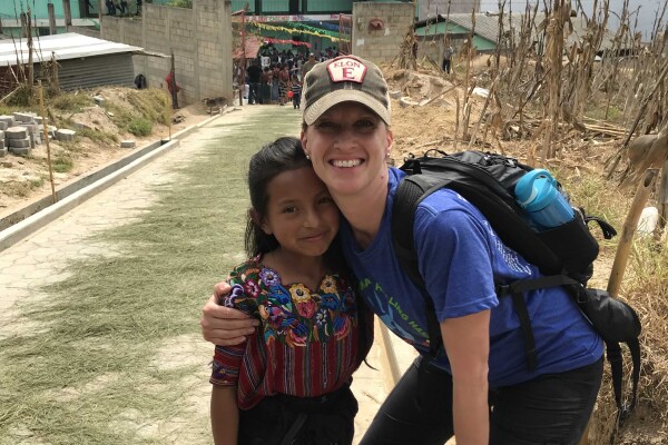 Rebecca Neiduski with a young girl in Guatemala.