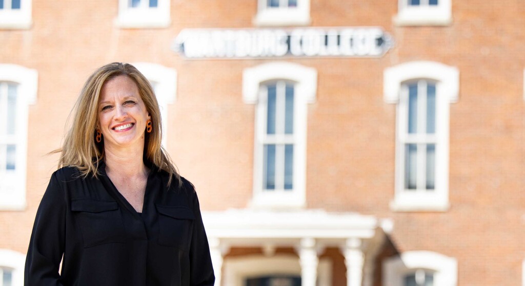 Rebecca Neiduski, Wartburg's 18th president, stands in front of Old Main.