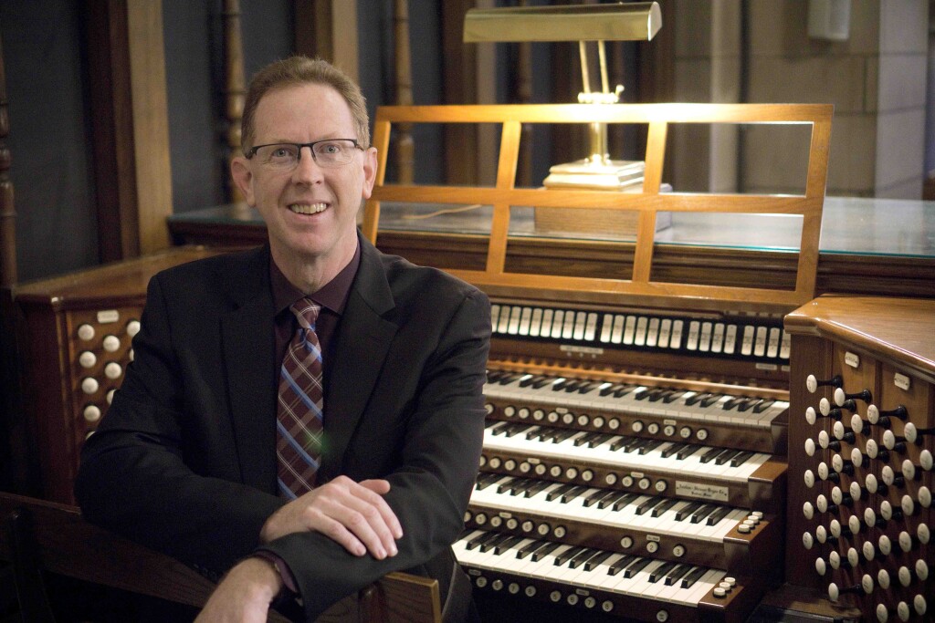 Robert Hobby sits in front of an organ