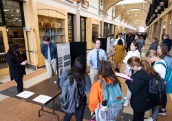 Students present their research in the Hall of Champions on RICE Day 2022