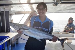 Elle Gadient with a Spanish Mackerel she line caught while working on a fishing boat in Australia in 2018.