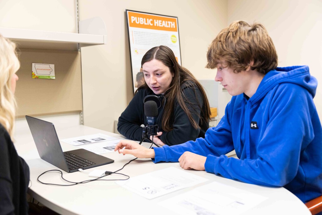 Wartburg students work with adjunct professor Annie Vander Werff to record public service announcements for World Grace Project, a Cedar Valley nonprofit, for a public health course. 