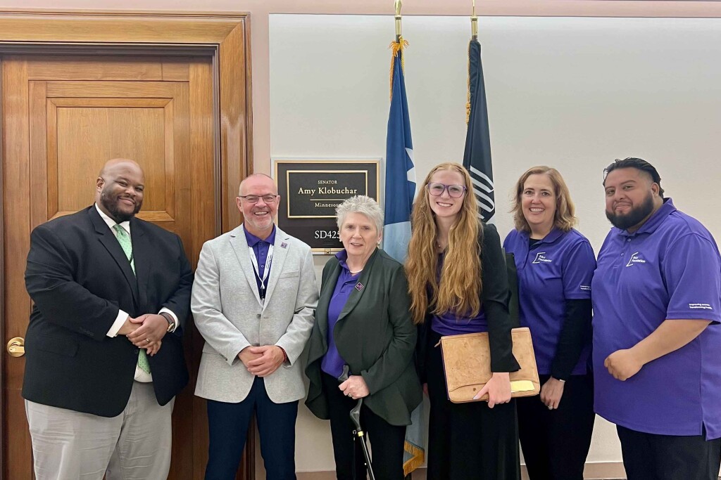 Hannah Radzwill stands with other lobbyists outside Amy Klobuchar's office in Washington D.c.