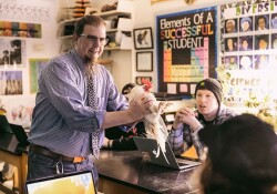 Dr. Bechtel shows a chicken to his Biology of Everyday Things class.