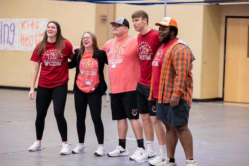 Ben Dunlap stands with a group of students in Levick Arena During Dance Marathon.
