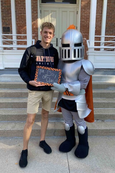 Cody Spiegelhalter poses with Sir Victor on the first day of school.