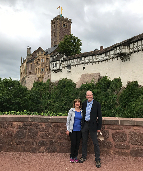 Carol and Randy Ratekin stand in front of the Wartburg Castle.